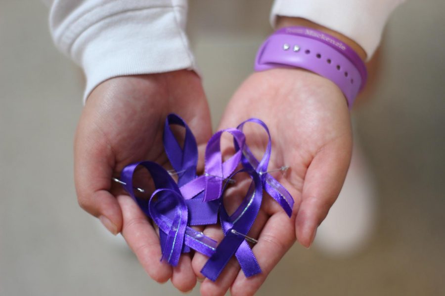 A group of students made ribbons for the student body to wear in honor of Mackenzie Cowan. 