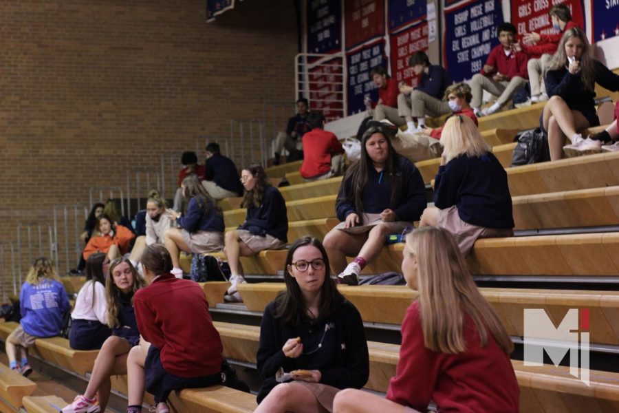 Bohaty and Rost members eat their socially distanced lunch on the gym bleachers on Oct. 28.