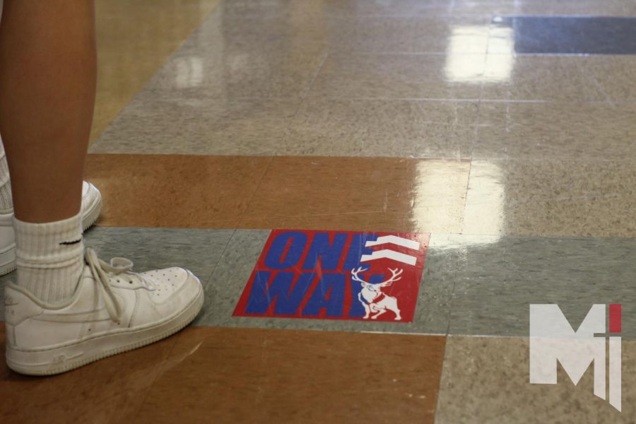 Miege has one-way hallway signs all over school to show the way. According to theology teacher Ross Dessert, this policy is recommended by the CDC and the Department of Education. 