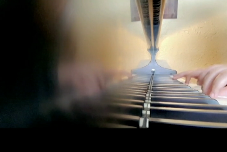 Junior Cara Parisi practices playing the piano. This is a regular part of her routine.