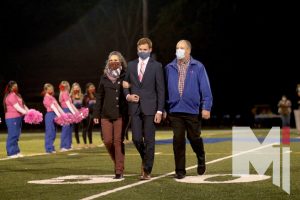 Senior Daniel Fontaine walks with his parents during this year’s Homecoming football game. Daniel’s mother, Jennifer (Tylicki) Fontaine was in the class of 1990, and his grandfather who was Walt Tylicki, the namesake of the Tylicki herd.