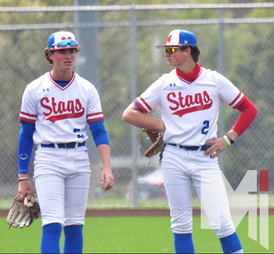 Standing together having a conversation between innings, Logan (left) and Luke (right) Shull wait to continue the team’s consistent start to the season. Both brothers will be playing baseball at Washburn University as other members of the senior class head to 28 different colleges to play. |