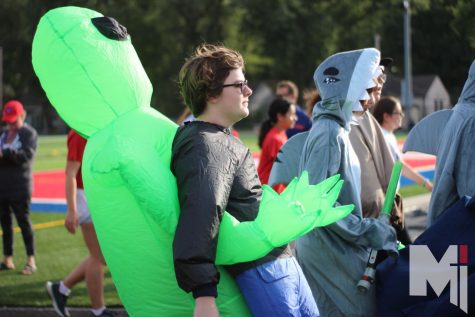 Walking steadily around the track, senior Sam Staley goes dressed as a person being carried off by an alien. The seniors were first to finish their laps and many went to get funnel cake or their Stag Strut t-shirt.
