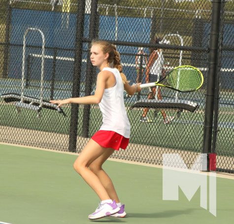 Watching for her opponents serve, freshman Breanna Quigley prepares to return the tennis ball back over the net. The match took place on Oct. 5 at the EKL tournament where Quigley finished in fourth place. 
