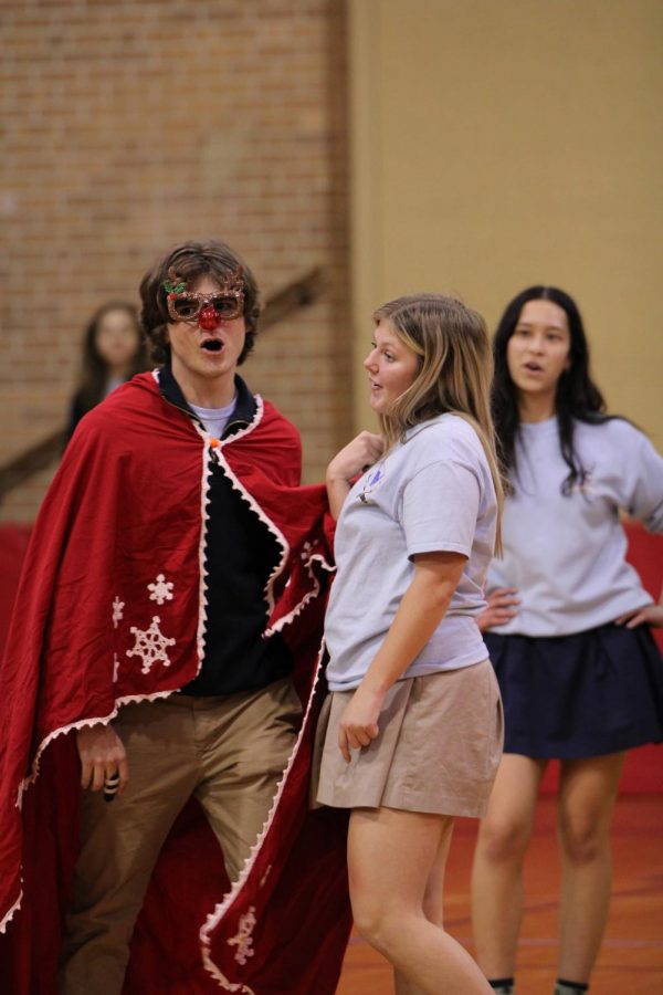 Seniors Olivia Griggs and John Siebes perform Santa Baby during the lip-sync battle on Thursday, Dec. 2. The battle took place during the school day as a special assembly.