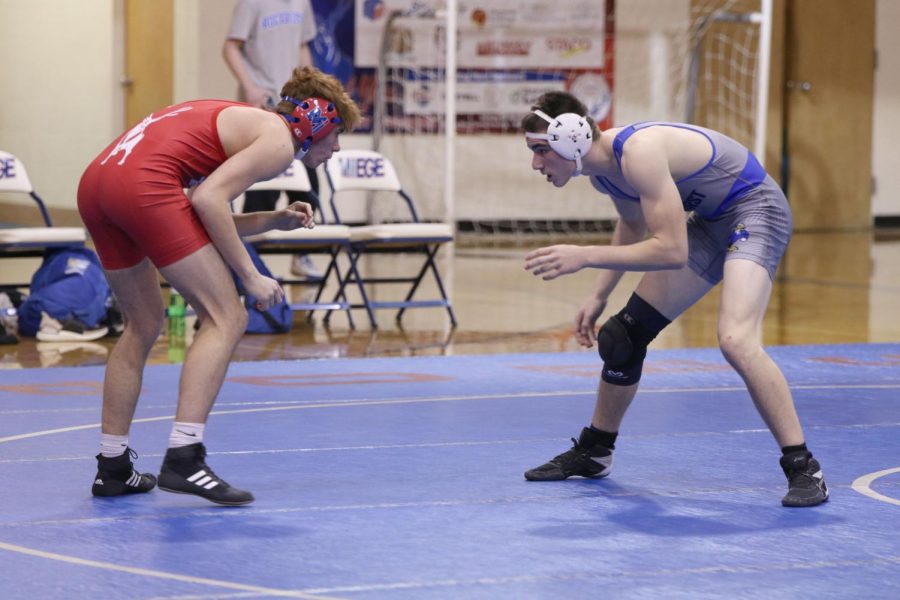 In the match, junior Grant Nicely eyes his opponents movements. 