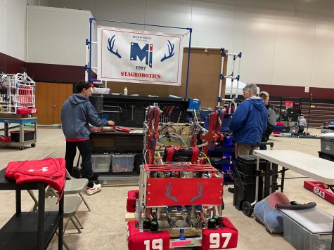 Junior Caleb Oblepias and Mr. Anderson set up the pit at the Greater Kansas City Regional.
