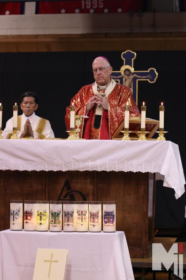 Archbishop Joseph Naumann celebrates the Eucharist on altar created by Fr. Anthony Mersmann.