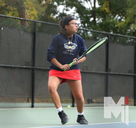 With her game face on, senior Dania Loredo competes in the singles tournament at tennis state. This was the first time Loredo competed at the state tournament. 