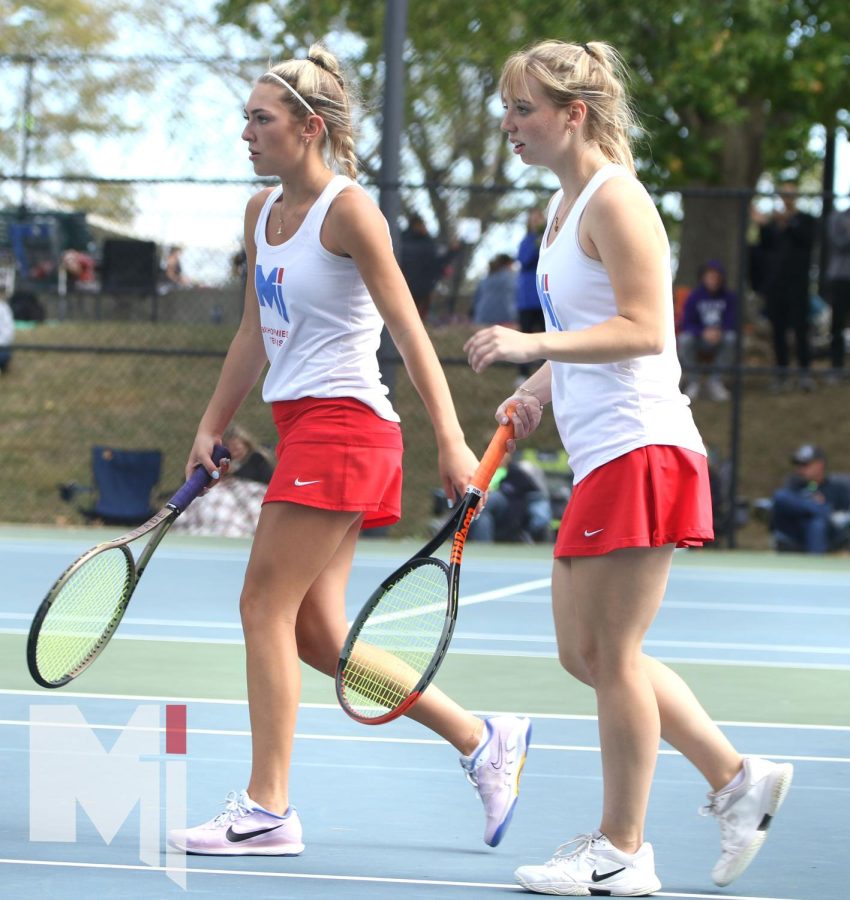 Competing at their last tennis state, senior Emma Lazarczyk and senior Claire Winklhofer walk together side by side. This year was their first year being doubles partners together. 