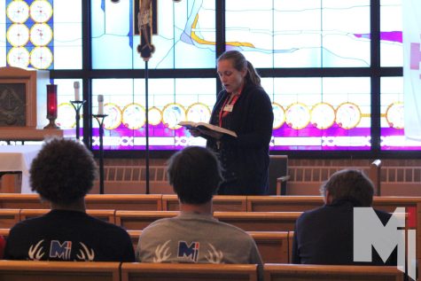 Reading from the Bible, junior Theology teacher Patricia Arnold takes her students to the chapel for chapel time. Chapel time is when Arnold reads verses from the Bible and get time to reflect.