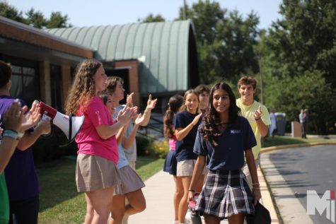Greeted by the herd council, freshman Isabella Castillo-Ruiz enters the school during freshman welcome. Freshman welcome took place before freshman orientation on Aug.15, where students received their chromebooks and schedules. “It was exciting, but also scary starting new things,” Castillo-Ruiz said.