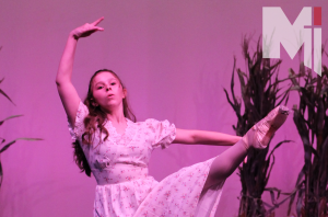 Performing in the schools rendition of Oklahoma!, freshman Isabella Dessert dances during the dream sequence. 