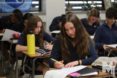  Writing down their class schedules, sophomores Avery Kurt, Shea Coughlan, Sophia Craig and Isabella Franco make their five-day finals study plans. The guidance department created the plans this year for the first time. Students received the plan during flex time to help them plan when they need to study for each of their finals. 