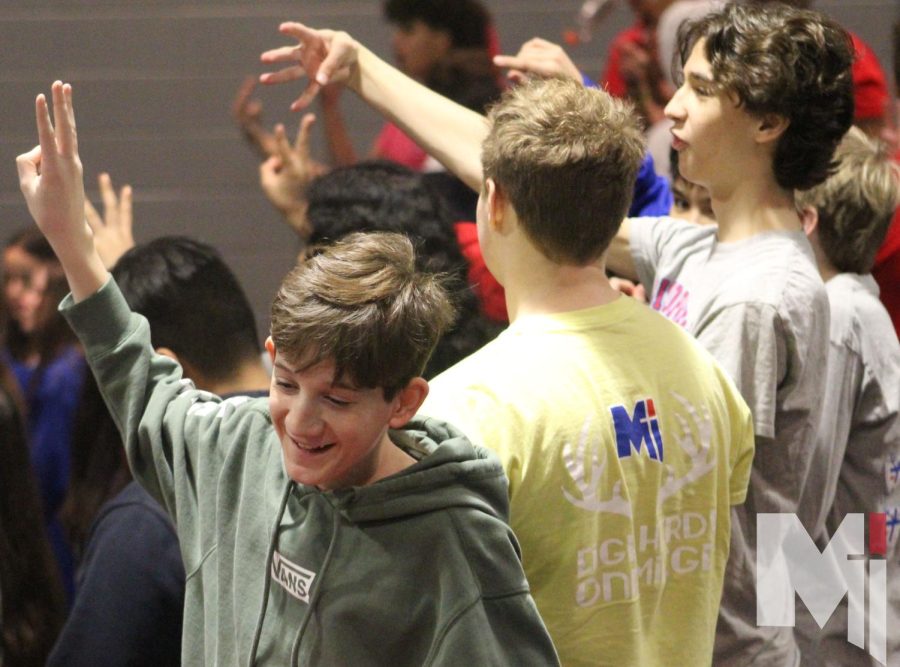 Holding up numbers, freshmen play the best friend game. At the NET Retreat that took place on Jan. 18-19, the class got to participate in fun activities including the best friend game.   