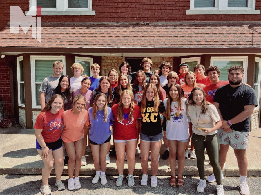 Arms around each other, the Kairos 75 group pose for the tradtional Kairos photo on Aug. 7. This retreat was led by the students that attended the junior Kairos the school year before.