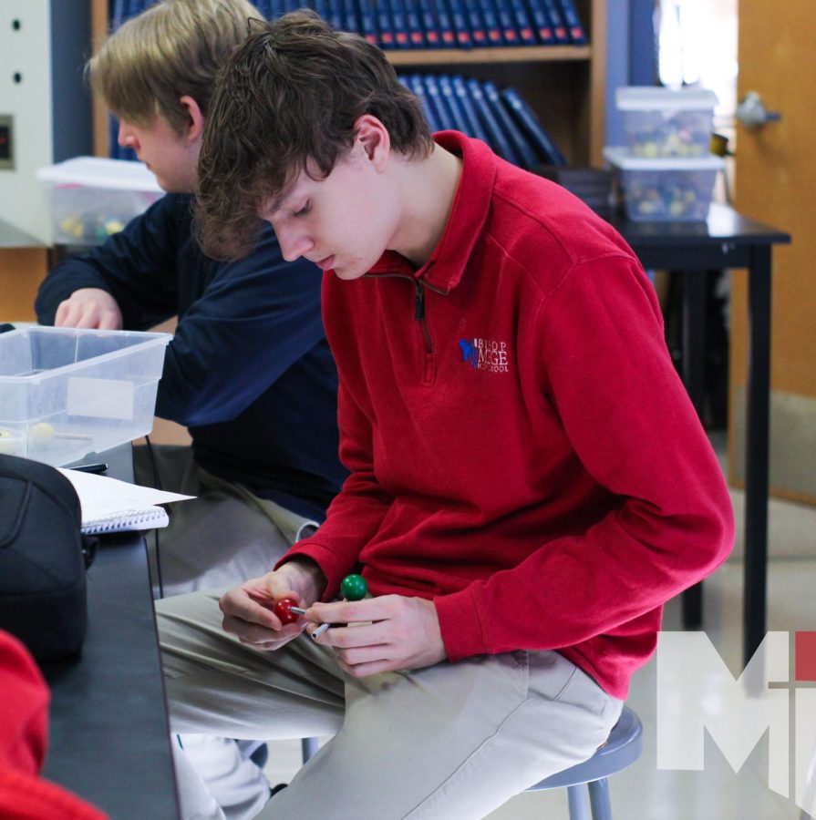 In the middle of Mrs. Lueckenotto’s chemistry lab, sophomore Jonas Pepin makes a water molecule. The model included balls for the atoms and metal connectors for bonds. “It was kind of confusing at times” Pepin said, “but we powered through.” 
