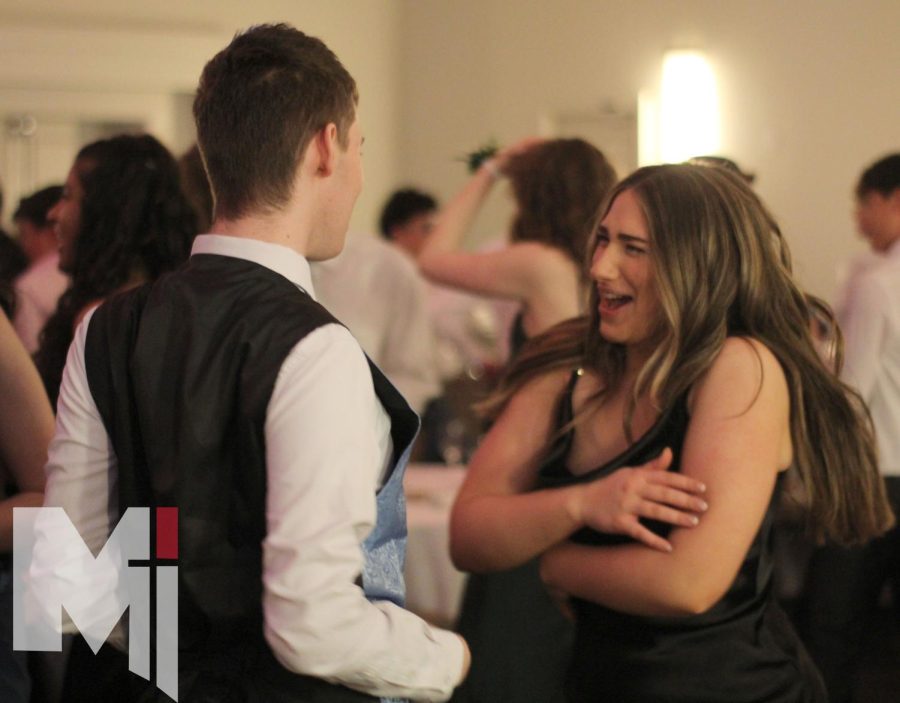 Dancing beside each other, juniors Isabelle Myers and Alex Smith experience their first Miege prom. Prom took place on April 1 at the Marriott Hotel. I liked how people were able to get rid of expectations and were free to have a good time, Myers said.