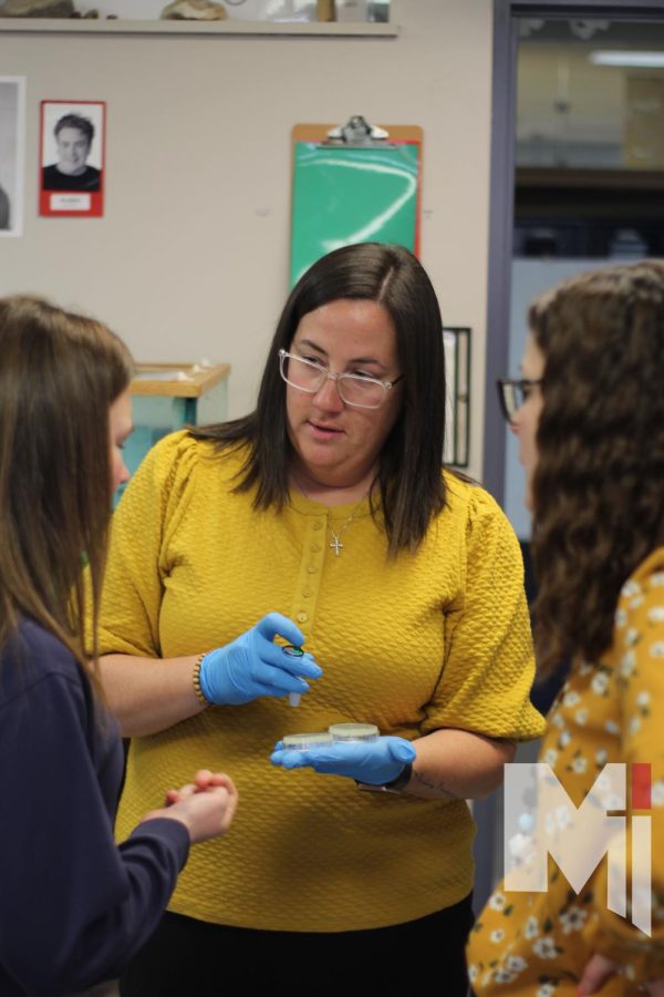 Science teacher Mary Beth Summers leads the way in her biomedical class. Students learned how to inject DNA into E. coli to make it glow. “The stuff they are learning in the book they are actually applying it,” Summers said. 

