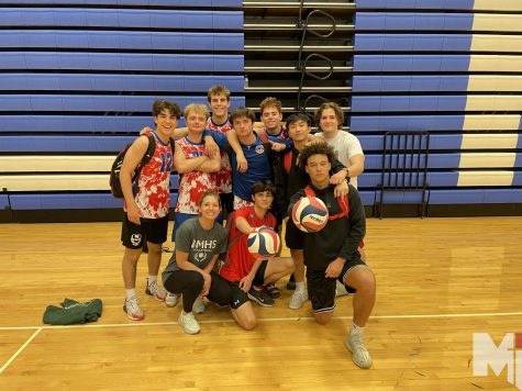 The boys team poses after its victory against Liberty High School. Head coach Lindsay Zych-Franco is new to coaching boys volleyball. 