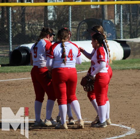 Huddling up, the team comes together to talk about its next play. Sophomore Wrigley Nolan is a transfer this year and it is her first year on varsity. I had high expectations for our season, and even though it started off a little rocky we are starting to gel as a team, Nolan said.