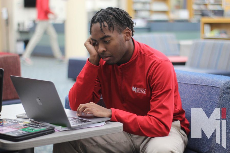 Senior Dallin Tatum catches up on some work in the math hub and uses his time wisely. Along with the puzzles, chess, and Rubik’s cubes, the math hub is a place to catch up with homework or relax and read a book. “Being in the math hub allows me to get ahead of my work, and focus on getting my grades up,” Tatum said. 
