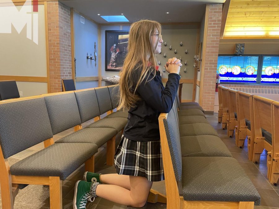 Katherine McGee prays in the chapel. As a Jewish student, McGee brings another faith perspective to her theology classes. 