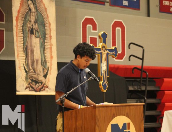 Junior Azael Gamboa reads two petitions at the Spanish Heritage month Mass on Sept. 15. The Mass brought tradition and culture to the Spanish community. I think it was a good Mass, getting to say it in a whole different language, Gamboa said.
