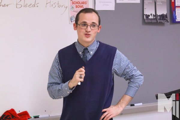Teaching his class on an ordinary day, English teacher Jacob Taylor’s outfit consists of a navy blue sweater vest and matching tie. His outfit is much more than ordinary, though, showcasing his unique choice of clothing.