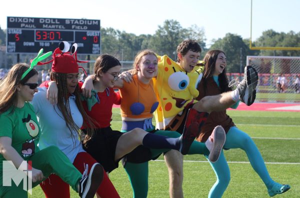 The second-place winners of the senior costume contest, dressed as “SpongeBob” characters, dance at Stag Strut. The members (from left  to right) consisted of Jamie Weiss, Anica Mackiewicz, Lanie Liston, Ainsley Murray, Alex Smith and Evie McBride. “I thought it was a really fun time and everybody enjoyed it, and I think the costumes this year were really unique and different from all the other years,” Murray said. 