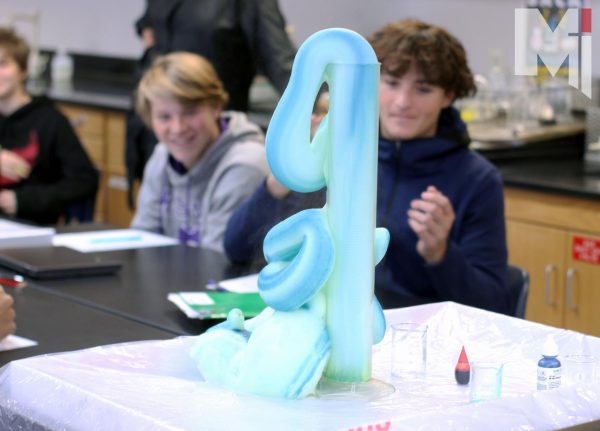 This halloween sophomore and freshman chemistry students had the opportunity to learn about the chemical reaction behind elephant’s toothpaste. Junior Emily Lueckenotto helped set up the activity and explain it to all the classes throughout the day. “The goal of elephant’s toothpaste was so that people watching could see the chemical equation in front of them happen in real life,” Lueckenotto said. 
