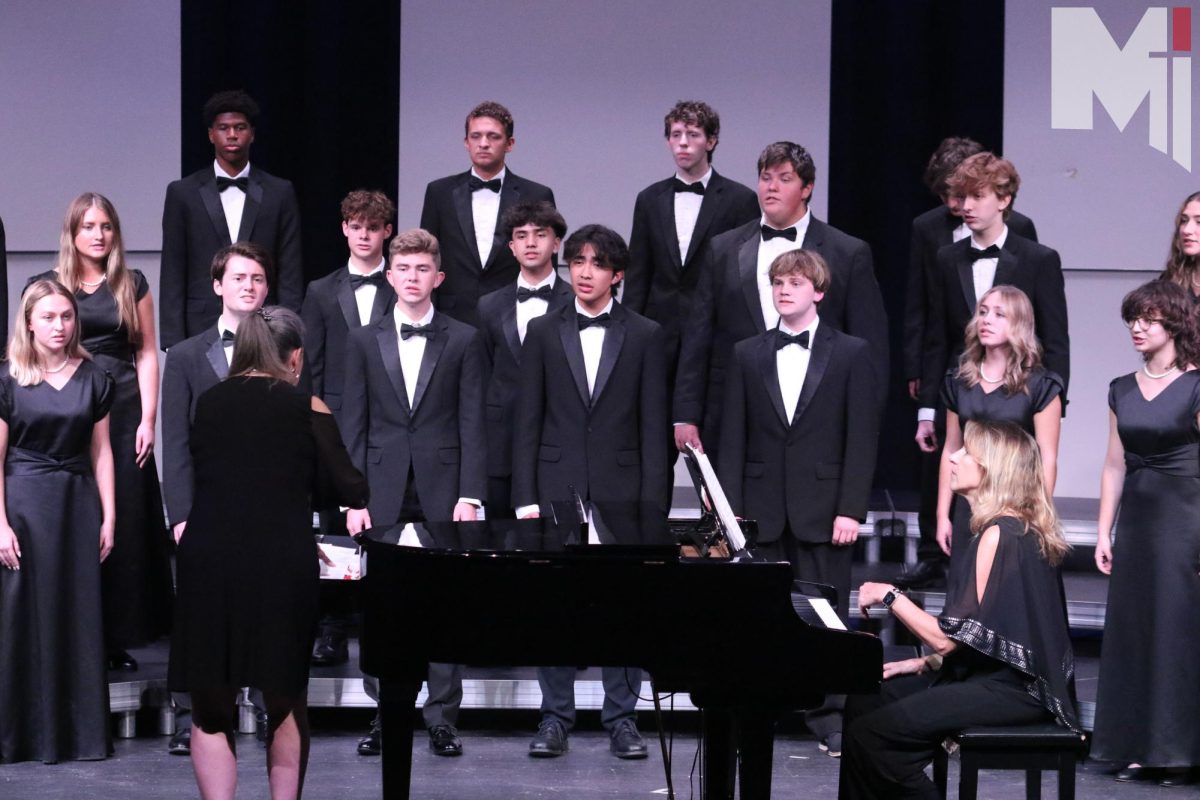 Cantare+Deum+performs+Emerald+Stream+at+the+fall+concert.+Junior+Tess+Sollars+is+competing+at+mixed+districts+choir+along+with+senior+Jacob+Drone+and+alternate+senior+Peter+Vani.