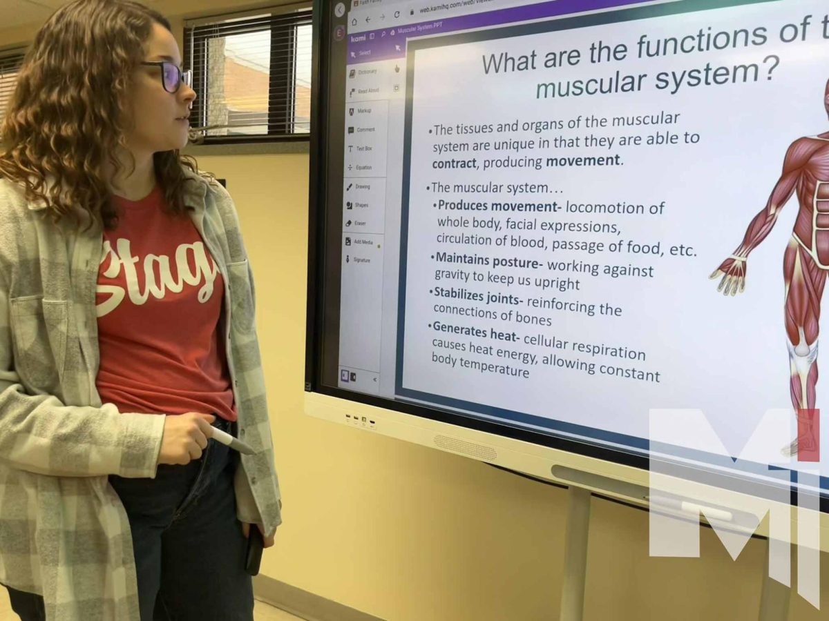 First-year biology and anatomy teacher Emily Knaus teaches anatomy students the muscular system. Knaus first went to college to become a physical therapist. 