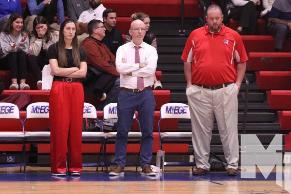 Girls basketball head coach Mike Allen watches warmups before the game against Liberty North on December 15.  Allen previously coached at Olathe South, where he reached three 6A substate championships in six years.