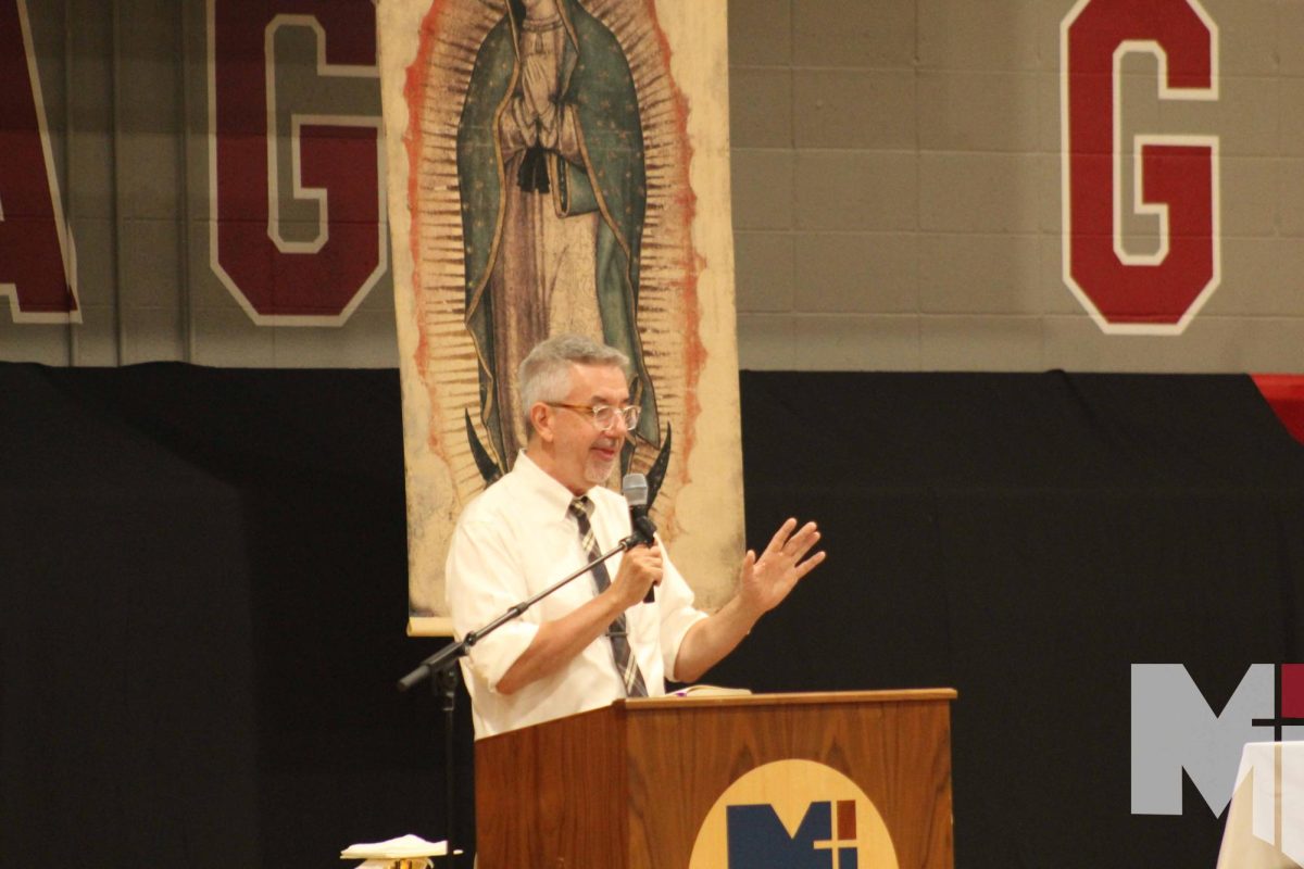 Campus+Minister+Bill+Creach+gives+a+speech+at+the+Spanish+Heritage+month+Mass+on+Sept.+15.+In+addition+to+his+role+with+Campus+Ministry%2C+Creach+pitches+in+with+the+monthly+all-school+Mass.+