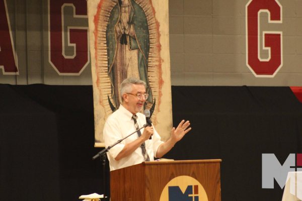 Campus Minister Bill Creach gives a speech at the Spanish Heritage month Mass on Sept. 15. In addition to his role with Campus Ministry, Creach pitches in with the monthly all-school Mass. 