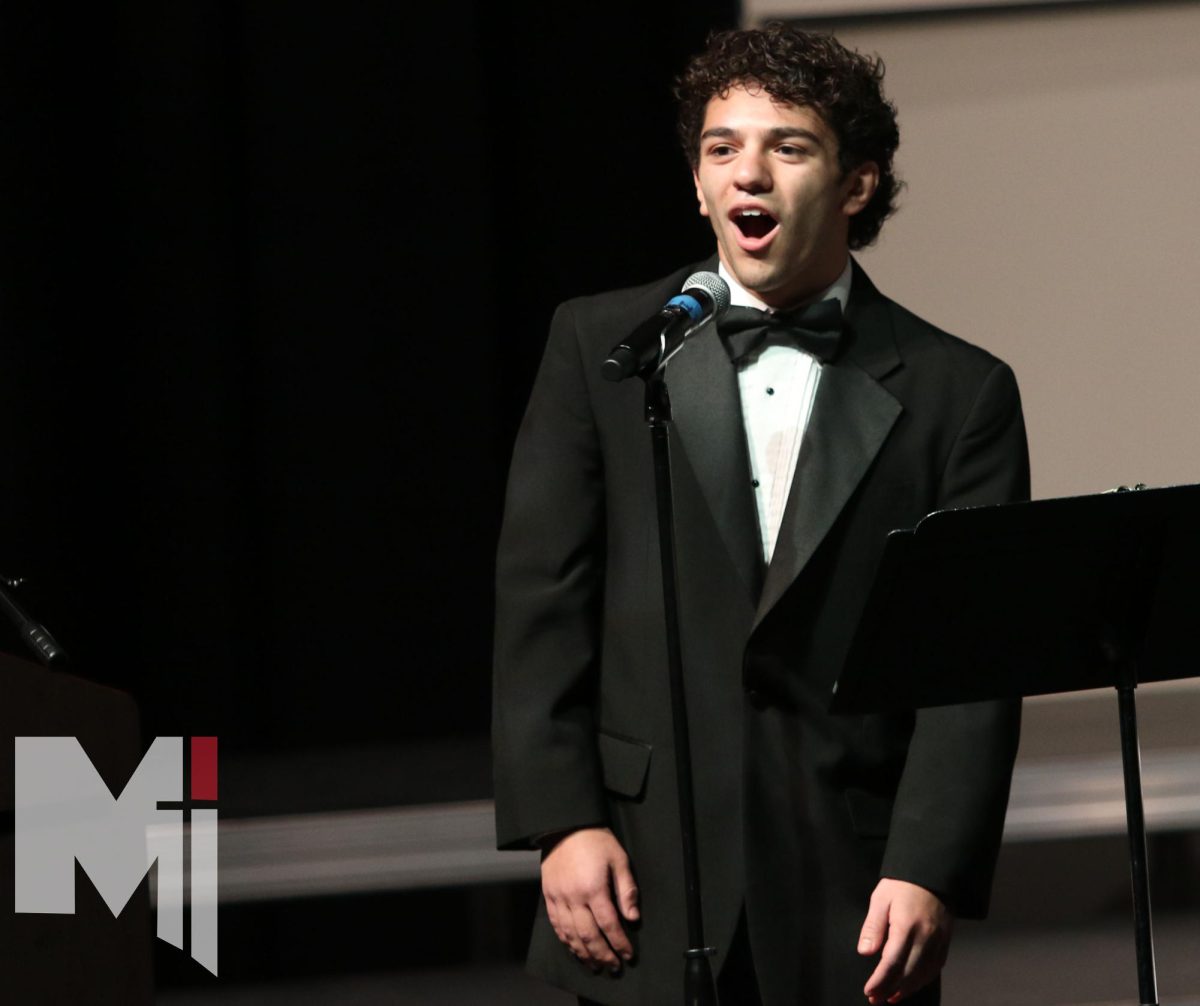 Senior Jacob Drone sings Frosty the Snowman during the Christmas medley. The medley is open to any members of Cantare Deum. 