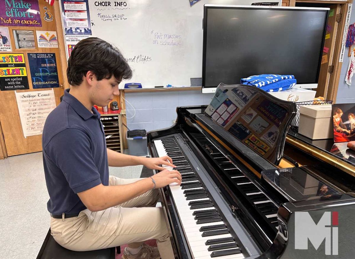 Sophomore Mateo Gajewski sits in the choir room, practicing piano. He is preparing a song to play for his friends. 