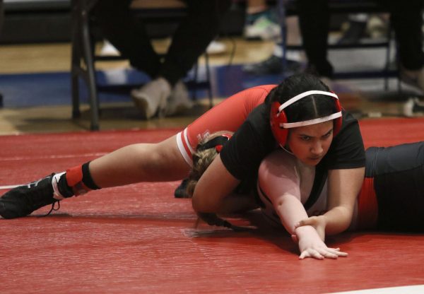 Won by a pin, sophomore Nancy Baca Olivas plays Blue Valley West opponent
after only joining the team this year. Along with the sense of community, Baca Olivas said she loves the
way the sport grows her mindset and makes her mentally and physically strong | EVIE MCBRIDE