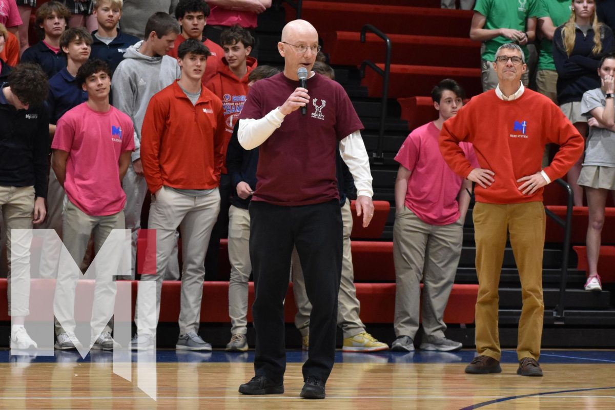 Looking back on the year, head girls basketball coach Mike Allen celebrates the teams’ incredible victories this year during the school assembly. In Allen’s first year coaching he went 22-3 and took the team all the way to the state championship. They have had the reigning title of 4A state champs since 2019, excluding 2020 when the tournament was canceled. 