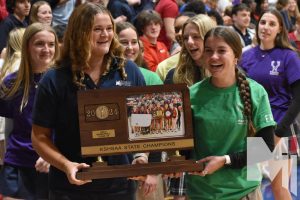 As the crowd stands up for the champions, senior Livi Shull takes it all in with fellow teammates. Shull described how the new coaching staff led them to state. “They adjusted greatly to us, and we adjusted to them and it all worked out great,” Shull said. “I am so very appreciative for the coaches and my team.” 