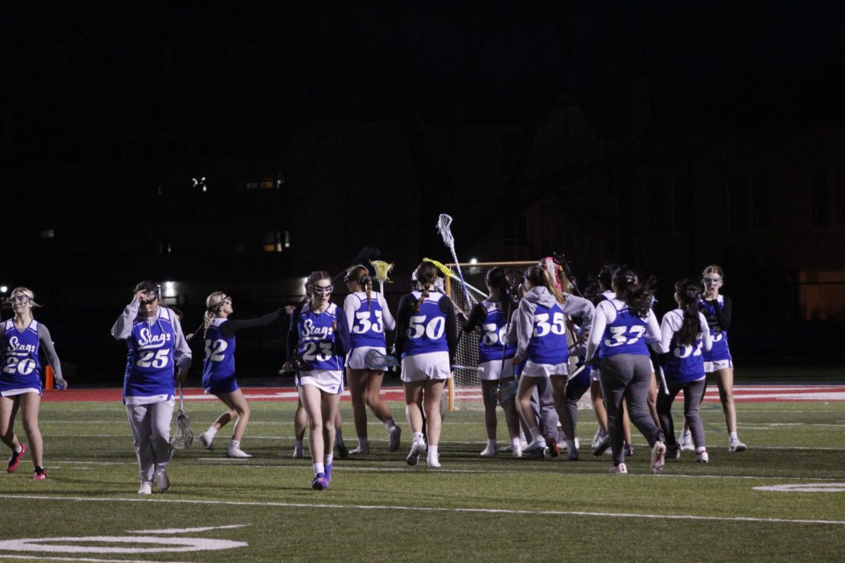 JV girls lacrosse goes out to 'thank their goalie', MVP Madi Nelson. Photo by Bella Dessert