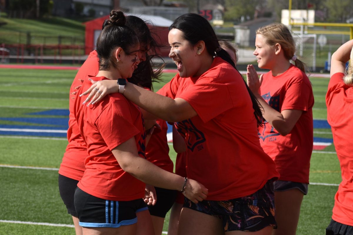 Juniors Olivia Lopez and Alexa Grijalva Salcido celebrate after Lopez scored a touchdown when playing in the Powder Puff competition on April 7. 