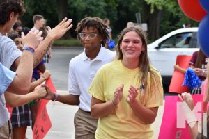 Greeted by the seniors, freshman Khi Allen walks up the red carpet at the freshmen welcome day filled with school spirit. “I was feeling a little bit nervous but also super excited at the same time to start a new school year,” Allen said. “There was a lot of school spirit that day, especially during the herd competitions, and the whole school is super spirited.”