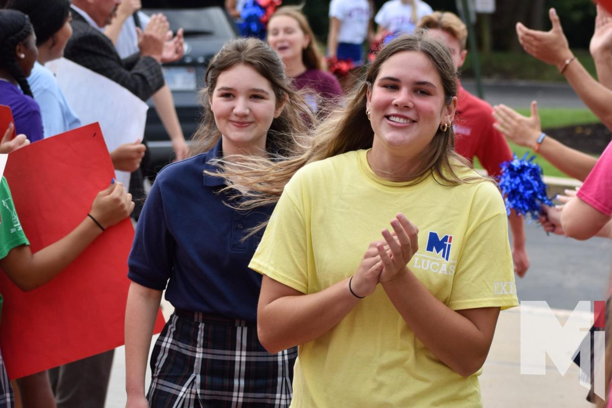 Ready and spirited for orientation, freshman Madison Marshall is led up the red carpet by senior Maddie Roberts. “I was feeling super excited but also nervous since I didn’t really know anyone walking into the building,” Marshall said. “The day was very empowering for me, and even though I was a little nervous, it really hyped me up for my first week which has been amazing with all the new friends I have made.”