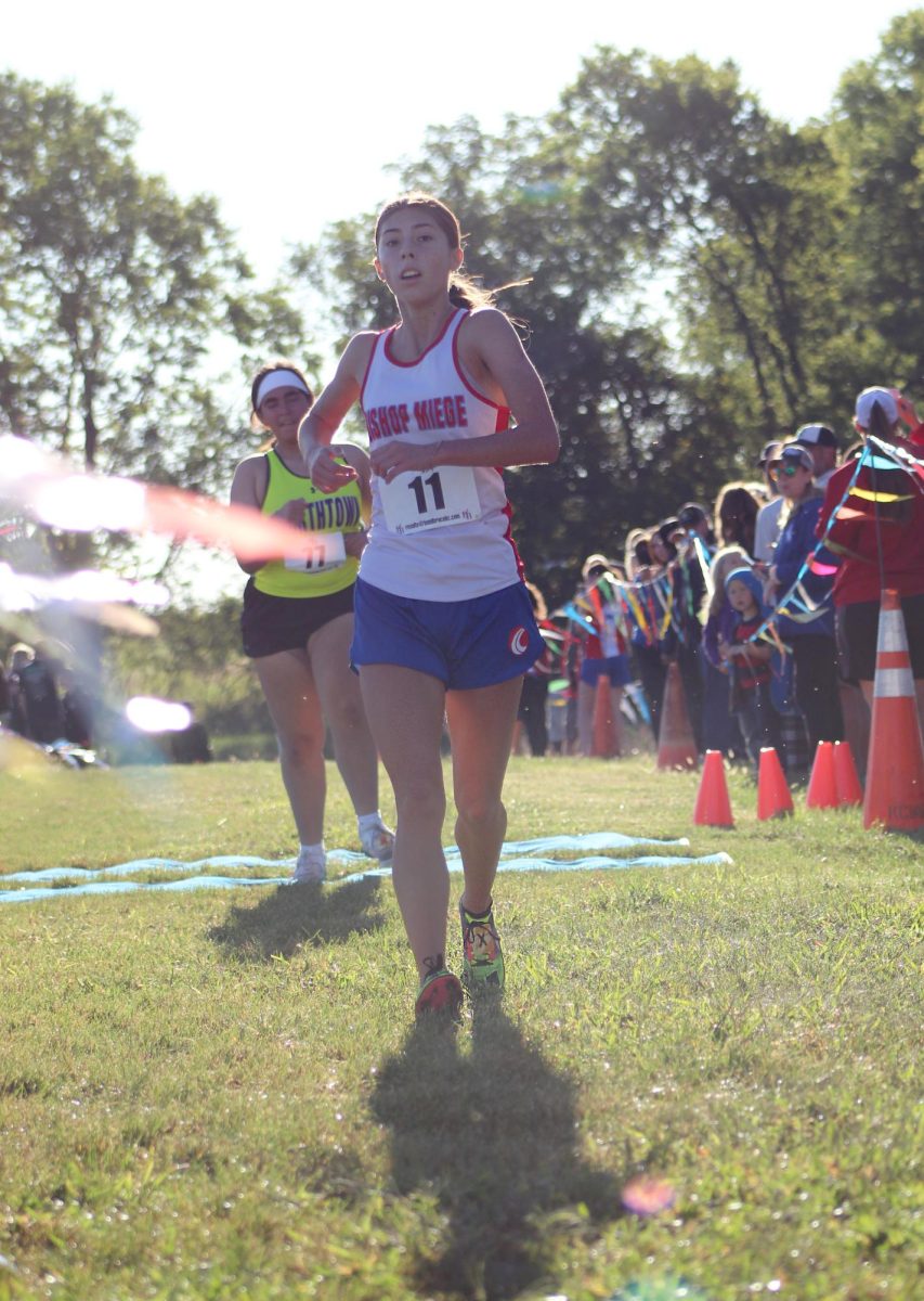 Leading the team to success, Senior Ella Aquino finished second in the girls varsity 5k race. Ella was feeling great as she crossed the finish line. “I was feeling a lot of happiness, because I've gotten third the past two years. Even though I got second, I ran a really good time, and I was really proud of it,” Aquino said. She is very optimistic about the new freshman on the team. “The freshman girls are really settling into the team, and they bring a lot of joy.” 