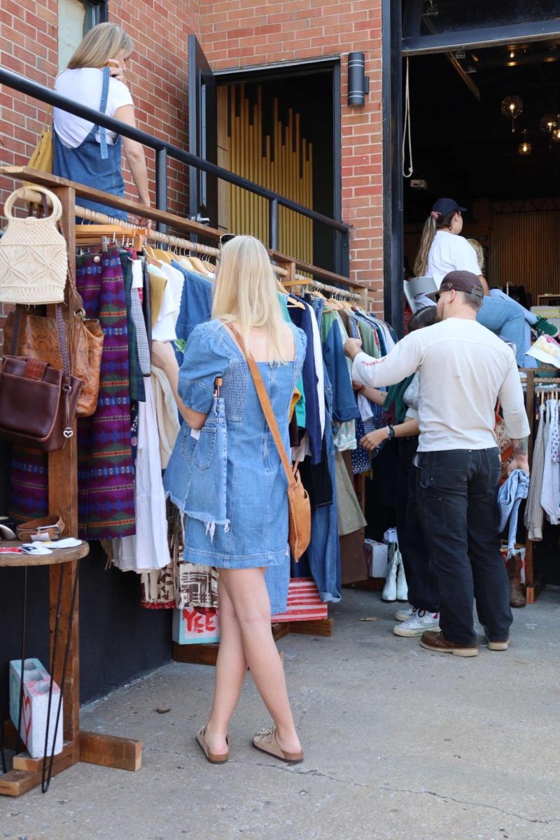 Parading through the River Flea Market, people indulge in an assortment of 1960 to 2000s styled clothing. 