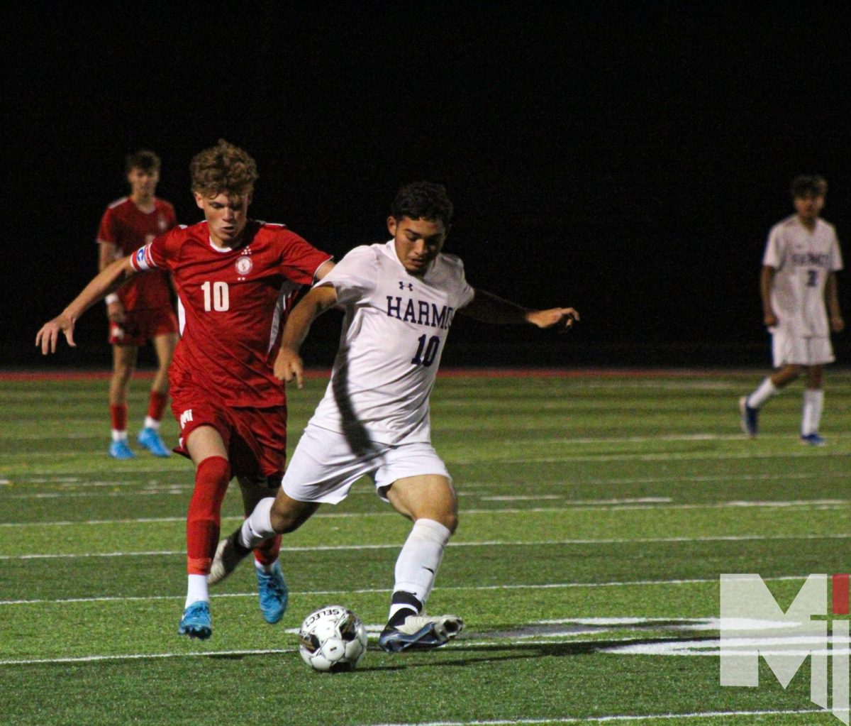 Determined to get the ball, senior Andrew Bergfeld assists the boy’s soccer team in scoring a victory against Harmon during their Semi-Final match. “It's fun but also sad that I'm leaving the team that I've been with for 4 years,” Bergfeld said. “My favorite memory was winning state my freshman year and all the different memories I’ve had.”