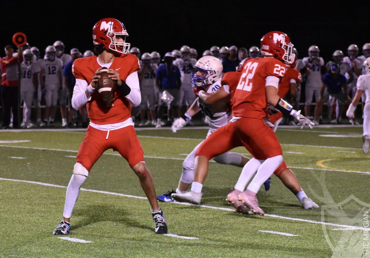 Defenders spare senior quarterback Marco Rodriguez time to throw the football to an open receiver.