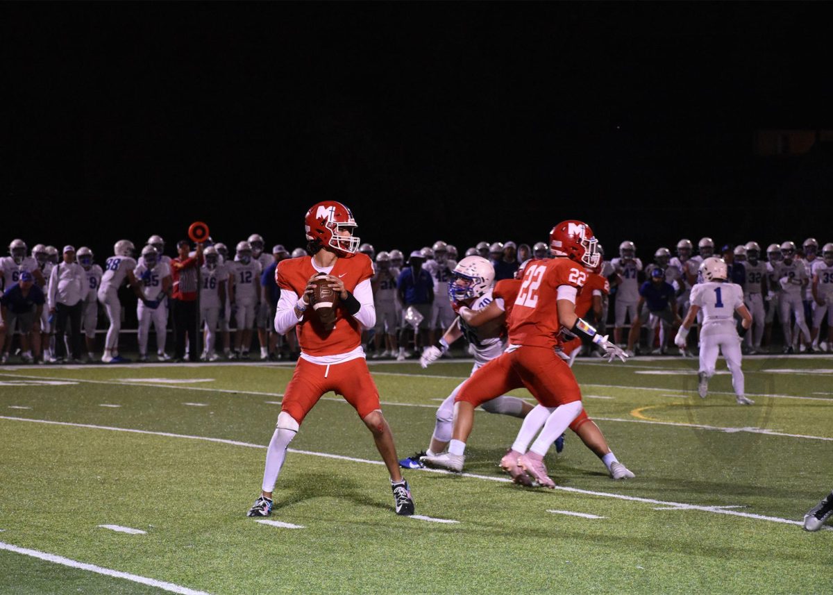 Defenders spare senior quarterback Marco Rodriguez time to throw the football to an open receiver. 